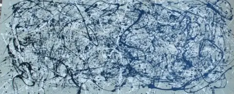 A drip painting in blue and white